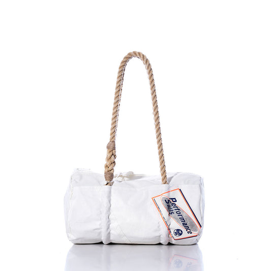 The Sea Bags Vintage Performance Sails Baguette Bag features a white rectangular design with a thick, hand-spliced hemp rope handle and a Performance Sailcloth tag attached; shown against a white background. by Sea Bags
