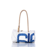 The Vintage 616 Baguette Bag by Sea Bags is a white and blue rectangular bag with a printed design, featuring a thick braided rope handle, shown against a white background. by Sea Bags