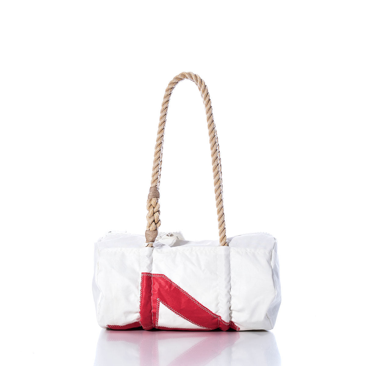 Sea Bags’ Vintage 41 Baguette Bag features a white rectangular design crafted from repurposed sailcloth, accented with hand-spliced hemp rope handles and a bold red V-shaped patch on the front reminiscent of classic sail insignias, presented against a plain white background. by Sea Bags