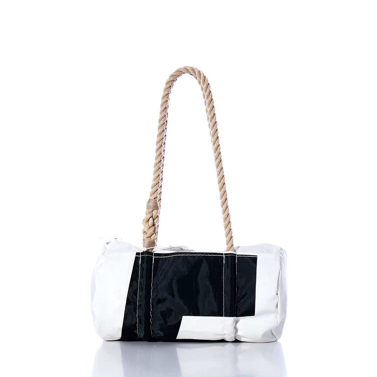 Sea Bags Vintage Black 5 Baguette Bag, featuring white and black panels with sail insignias and sturdy, hand-spliced hemp rope handles, displayed on a white reflective surface. by Sea Bags