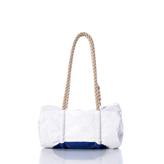 The Sea Bags Vintage Blue 6 Baguette Bag is a white rectangular tote with a blue bottom and hand-spliced hemp rope handles evoking nautical charm, shown against a white background. by Sea Bags