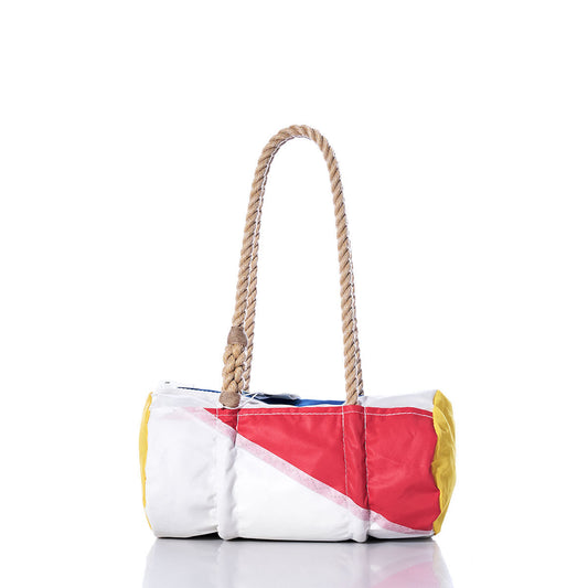 The Sea Bags Vintage Multicolor Baguette Bag, crafted from recycled red, white, blue, and yellow sails in a cylindrical shape, features two thick hand-spliced hemp rope handles and is shown isolated on a white background. by Sea Bags
