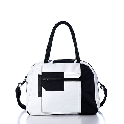 The Sea Bags Vintage Black 7 Essential Weekender Travel Bag, featuring a classic black and white design, front zipper pocket, two sturdy handles, and a detachable shoulder strap, is photographed against a white background. by Sea Bags