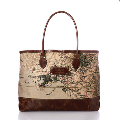The Heritage Aello Large Tote by Sea Bags features leather handles and trim, with a printed vintage map design on the front inspired by the legendary voyages of the iconic Greek sailing yacht S/Y AELLO, all set against a white background.