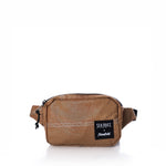 Vintage Caramel Tanbark Belt Bag in tan recycled sail cloth, featuring a black zipper, black Sea Bags brand patch, and white zigzag stitching.