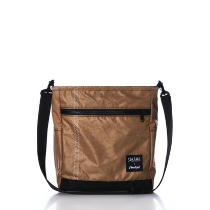 Vintage Caramel Tanbark Voyager Medium Crossbody bag in tan with a black zipper, black bottom panel, and black adjustable shoulder strap, crafted from vintage recycled sail cloth.