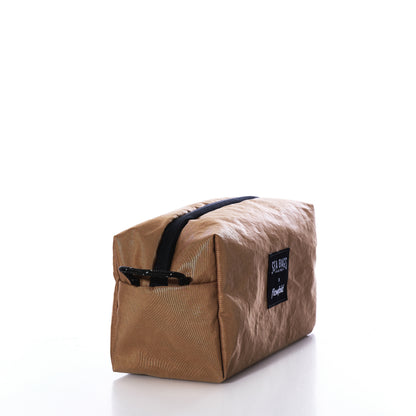 Vintage Caramel Tanbark Toiletry Bag made from tan recycled sail cloth with a black zipper and a rectangular Sea Bags brand patch on the side.