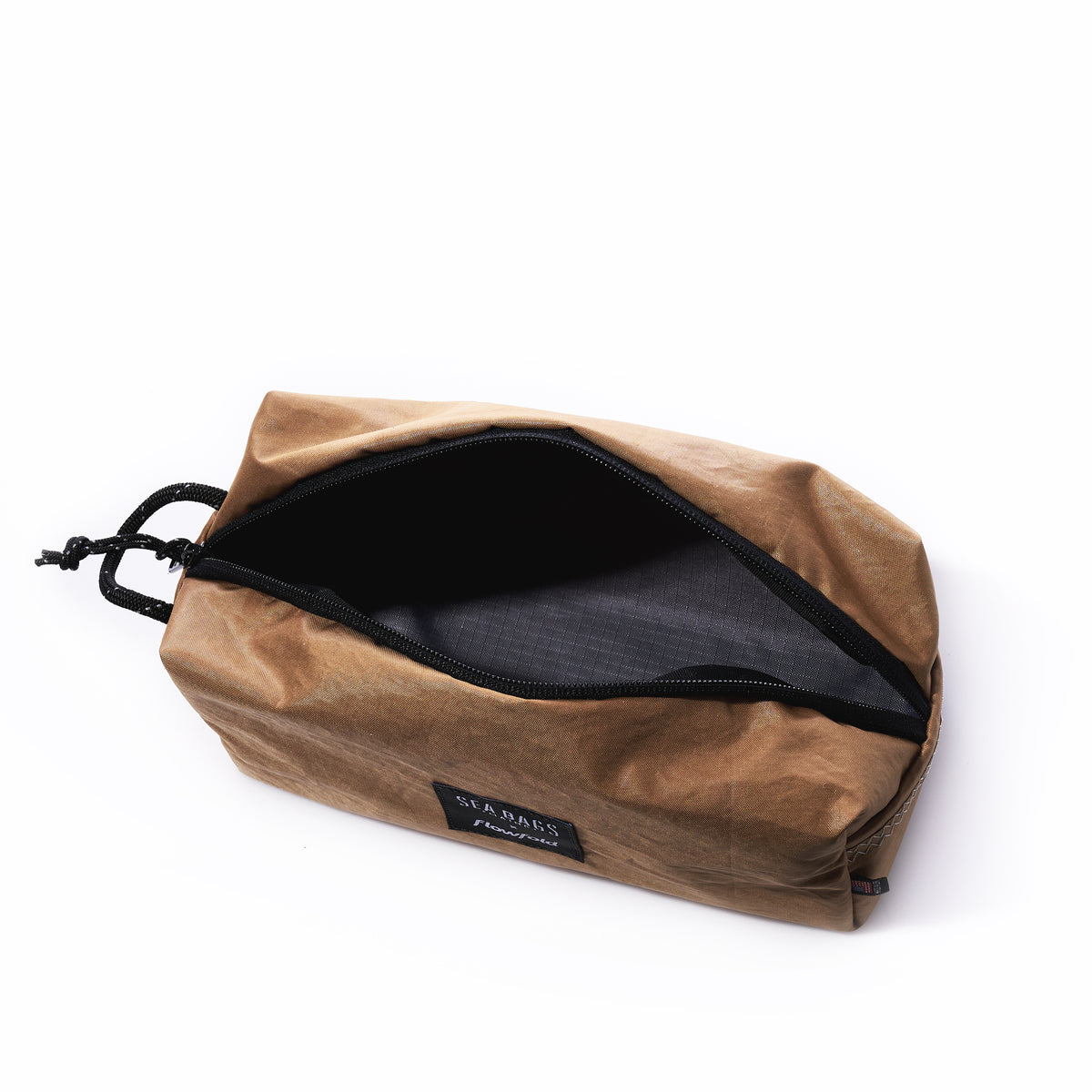 Rectangular Vintage Caramel Tanbark Toiletry Bag in tan with an open zippered top and a black interior lining.