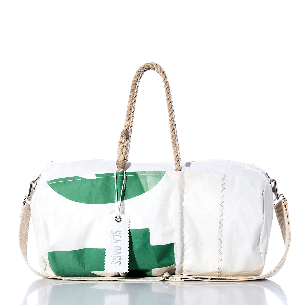 The Sea Bags Vintage 14 Duffel is a white and green duffel bag made from recycled sail cloth, featuring sturdy hemp rope handles, a canvas shoulder strap, and a visible Sea Bags tag, displayed against a white background. by Sea Bags