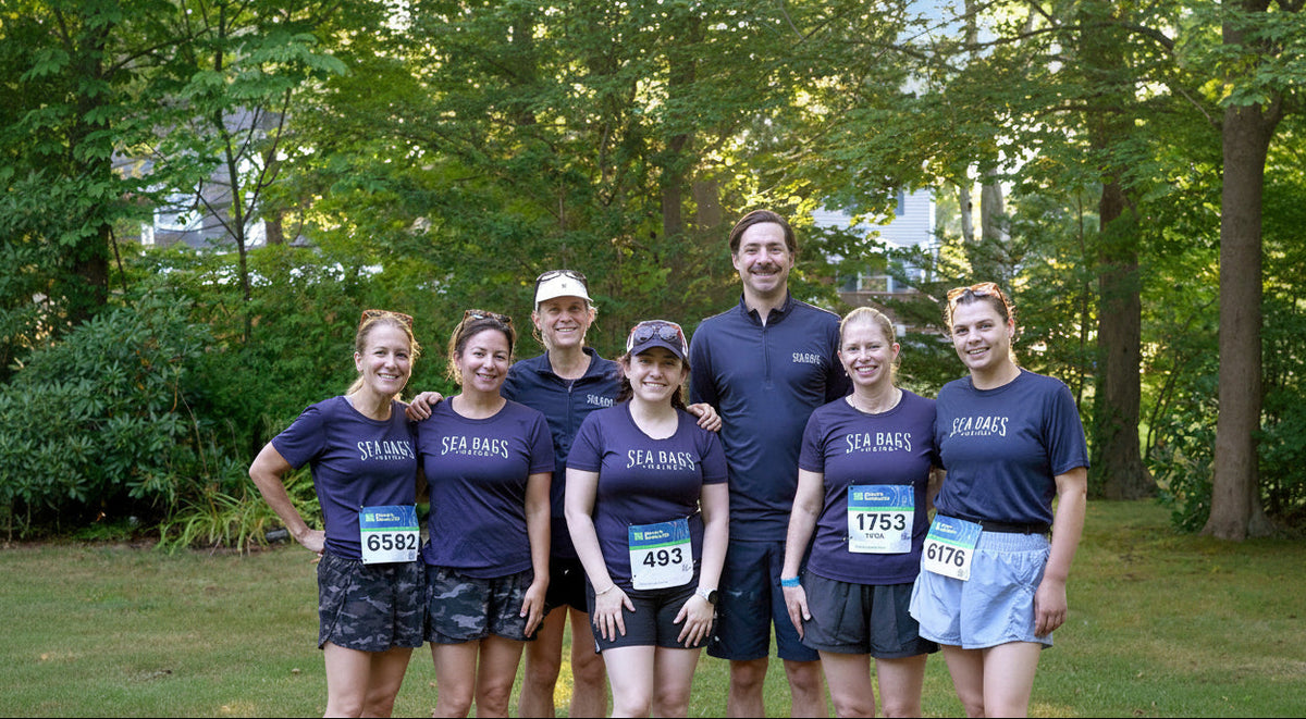 2026 beach to beacon sea bags running team pictured near some trees and all smiling after the race