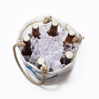 Six bottles on ice in the Sea Bags Multicolor Lobster Beverage Bucket, crafted from recycled sail cloth with rope handles and shown from above against a plain white background. by Sea Bags
