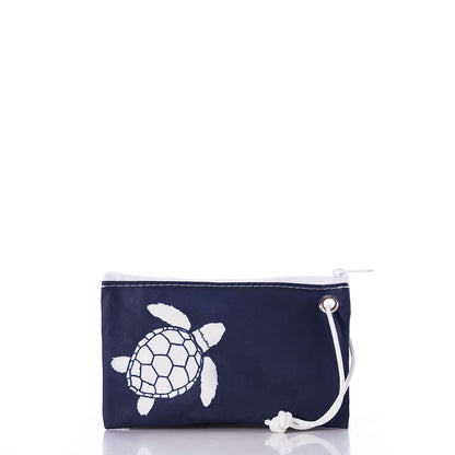 The White-on-Navy Sea Turtle Wristlet by Sea Bags is a small navy zippered pouch featuring a white sea turtle graphic and a white cord loop for easy carrying, crafted from recycled sails for an eco-friendly accessory perfect for hands-free use. by Sea Bags