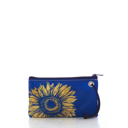 The Sea Bags Sunflower Wristlet features a bold yellow sunflower design on a blue zippered pouch, complete with a black wrist strap—an ideal accessory for nature lovers who appreciate striking floral accents. Displayed against a white background. by Sea Bags