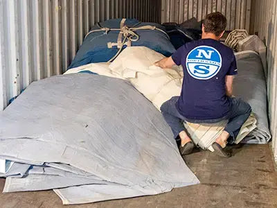 Sea Bags crew member collecting sails