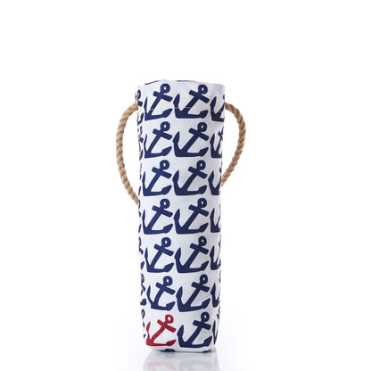 Introducing the Sea Bags Anchor Pop Wine Bag—a cylindrical wine tote made from recycled sail cloth, showcasing navy blue anchor patterns and accented with a single red anchor at the bottom. It features a sturdy rope handle and comes on a crisp white background, making it an ideal hostess gift. by Sea Bags