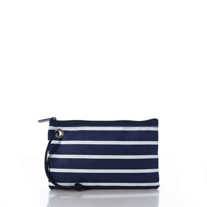 The Sea Bags Red Anchor on Navy Stripes Wristlet is a lightweight accessory crafted from recycled sails, featuring horizontal white stripes on navy, a bold red anchor motif, a black zipper, and a black wrist strap—perfect as a nautical wristlet and shown here on a white background. by Sea Bags