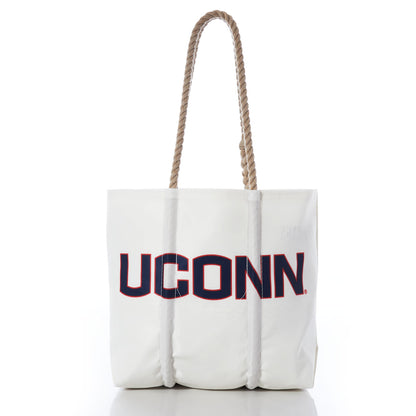 Introducing the UCONN Tote by Sea Bags—a stylish white tote featuring UCONN printed in bold navy and red letters on the front. Crafted with sturdy hemp rope handles, this practical bag has a clean white background and comes complete with a collegiate hang tag, making it both fashionable and perfect for everyday use. by Sea Bags