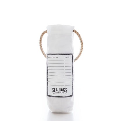 Multicolor Lobster Wine Bag by Sea Bags—a white cylindrical recycled sail bag with a rope handle, featuring a recycling information label and Sea Bags branding on the front. Displaying distinctive Maine lobster artwork, this functional and stylish wine carrier stands out against a white background. by Sea Bags