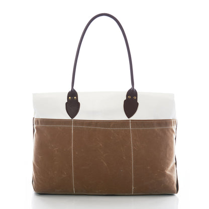 Sea Bags Tan Chebeague Large Travel Tote, crafted from recycled sail cloth in brown and white canvas with dark brown leather handles, photographed on a white background. by Sea Bags