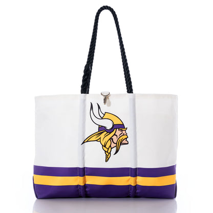 The Sea Bags Minnesota Vikings Tailgate Tote is a white recycled sail cloth bag with black handles, showcasing the Minnesota Vikings logo and purple and yellow stripes near the base. This stylish tote is perfect for any Vikings fan who values both team spirit and sustainability. by Sea Bags