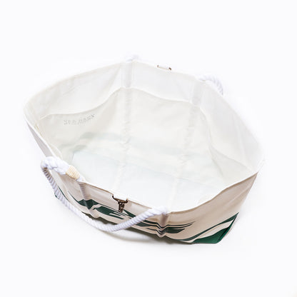 Top view of the Sea Bags New York Jets Tailgate Tote, an empty white sail cloth bag with rope handles and green design accents on the outer sides, inspired by a classic Jets aesthetic. by Sea Bags