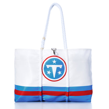 Crafted from recycled sail cloth, the Tennessee Titans Tailgate Tote by Sea Bags showcases navy handles, bold blue stripes along the bottom, and the iconic sports team logo featuring a flaming circle, T, and three stars—making it the ultimate NFL accessory for true Titans fans. by Sea Bags