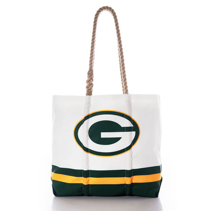 The Sea Bags Green Bay Packers Medium Tote is crafted from recycled sail cloth for durability and eco-friendliness. This white tote features rope handles, the iconic Green Bay Packers G logo, and green and yellow stripes along the bottom. by Sea Bags