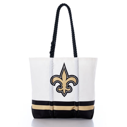 The New Orleans Saints Medium Tote by Sea Bags is made from recycled sail cloth and features bold black and gold bands at the base, sturdy black rope handles, and a large black and gold fleur-de-lis emblem on the front—an ideal choice for Saints fans seeking a sustainable and stylish accessory. by Sea Bags