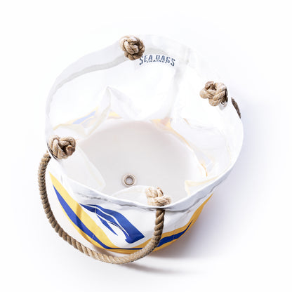 A Los Angeles Rams Beverage Bucket by Sea Bags, crafted from white and yellow sail cloth with rope handles, is shown from above with an empty interior, a metal grommet on the bottom, and is designed as a sustainable cooler. by Sea Bags