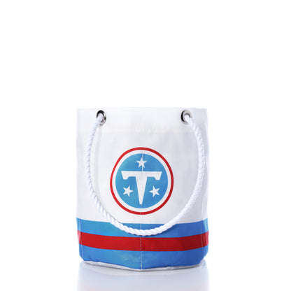 Tennessee Titans Beverage Bucket by Sea Bags, featuring blue rope handles, blue stripes at the bottom, and a Tennessee Titans football team logo on the front. Crafted from recycled sail cloth for an eco-friendly touch. Shown on a white background. by Sea Bags