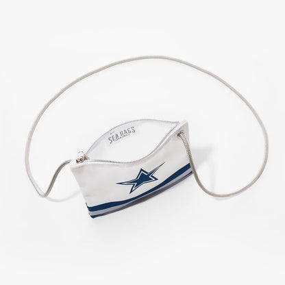 Sea Bags Dallas Cowboys Slim Crossbody, made from recycled sail cloth and displayed on a white background, features a white zippered design adorned with a blue star logo inspired by the Dallas Cowboys, blue stripes near the base, and a thin shoulder strap. by Sea Bags