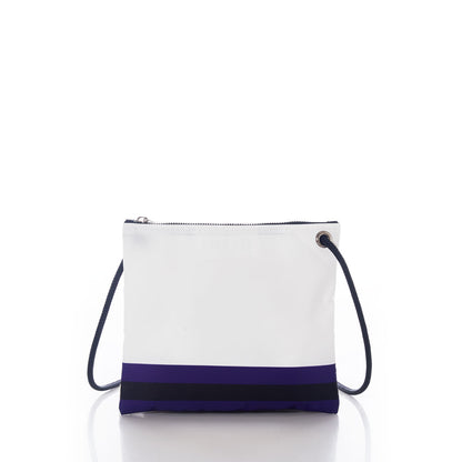 The Sea Bags Baltimore Ravens Slim Crossbody is a white bag crafted from recycled sail cloth, featuring a distinctive black and navy blue stripe near the bottom, a zip closure at the top, and a dark shoulder strap, displayed on a white background. by Sea Bags