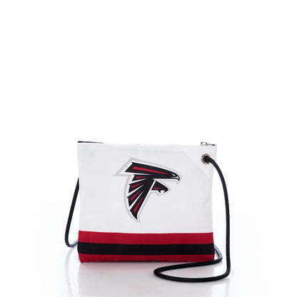 The Atlanta Falcons Slim Crossbody by Sea Bags is a white bag crafted from durable recycled sail cloth, featuring the teams logo, black and red stripe accents, a black strap, and a zippered top. Displayed against a white background, this crossbody is perfect for every dedicated Atlanta Falcons fan. by Sea Bags