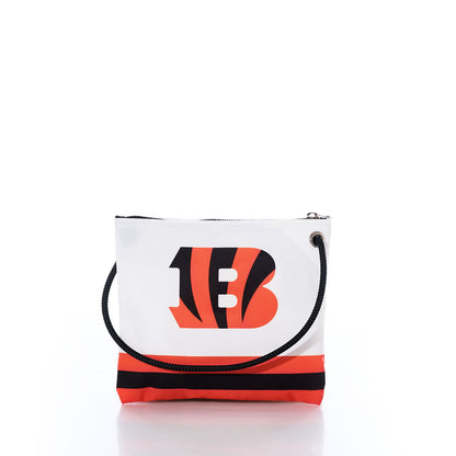 Introducing the Sea Bags Cincinnati Bengals Slim Crossbody: a striking white and orange zippered bag with a black rope handle, skillfully crafted from recycled sail cloth. This fan-favorite features a bold stylized B logo with tiger stripes and two horizontal stripes near the bottom—perfect for showcasing your Bengals spirit. by Sea Bags