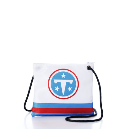 Introducing the Tennessee Titans Slim Crossbody from Sea Bags—a sustainable white crossbody bag made from recycled sail cloth, featuring the Tennessee Titans football team logo. Designed with a bold blue stripe near the bottom and finished with a black and blue striped strap, this eco-friendly accessory is perfect for any Titans NFL fan. by Sea Bags