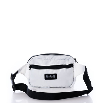 Miami Dolphins Belt Bag by Sea Bags, crafted from recycled sail cloth and designed with black zippers and a black adjustable strap. The sustainable white belt bag features a front pocket adorned with the Sea Bags logo patch, shown against a white background. by Sea Bags