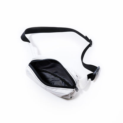 The Sea Bags Miami Dolphins Belt Bag, a white sustainable design with a black adjustable strap and a zippered main compartment, is shown open on a white background. by Sea Bags