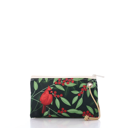 Introducing the Winterberry Cardinals Wristlet by Sea Bags—a small zippered pouch with a wrist strap, adorned with striking red cardinals perched among green leaves and red berries on a black background. This festive holiday accessory also serves perfectly as a handy gift card holder, making it an ideal seasonal accent or thoughtful gift. by Sea Bags