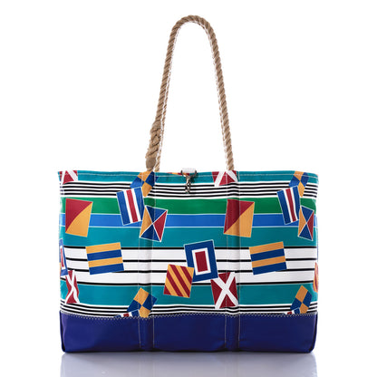 Introducing the Signal Flags Ogunquit Beach Tote by Sea Bags—a vibrant, water-resistant tote crafted from recycled sail cloth. Showcasing rope handles and bold nautical flag designs with horizontal stripes in blue, green, white, yellow, and red, this eco-friendly bag blends sustainability with coastal style for all your seaside adventures. by Sea Bags