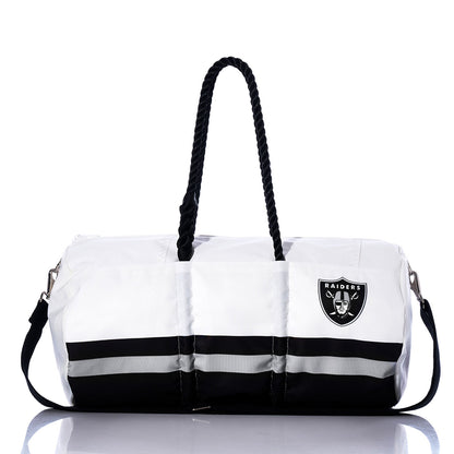 Show off your team spirit with the Las Vegas Raiders Duffel by Sea Bags—a white and black bag featuring sturdy black handles, a convenient shoulder strap, and the iconic Raiders logo on one side. Made from durable materials, this versatile Sea Bags duffel is ideal for travel or game days and perfect for any Las Vegas Raiders fan. by Sea Bags