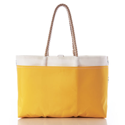 Blue Stripe Ogunquit Beach Tote by Sea Bags, crafted from recycled sail cloth with two thick rope handles and finished with a white top trim, photographed against a white background. by Sea Bags