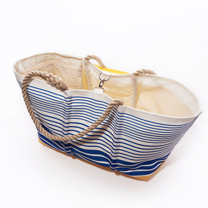 The Sea Bags Blue Stripe Ogunquit Beach Tote, crafted from recycled sail cloth with blue and white stripes, rope handles, and a beige interior, is displayed open against a white background. by Sea Bags