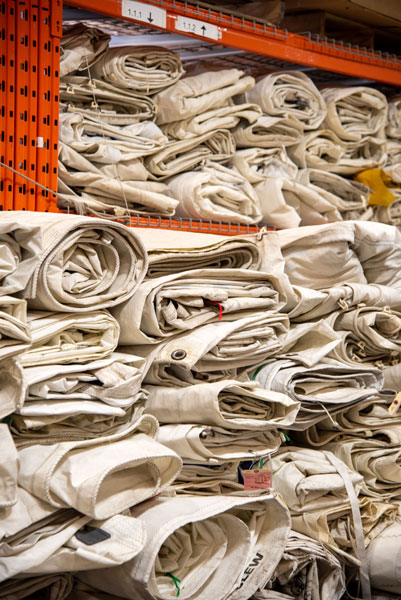 Rolled up sails in our warehouse