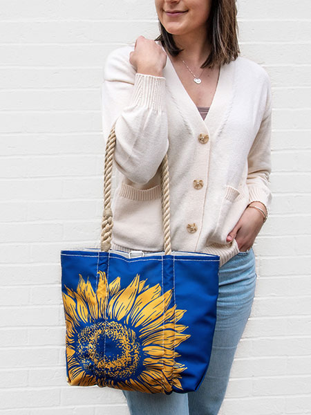 Woman holding Sunflower Hangbag