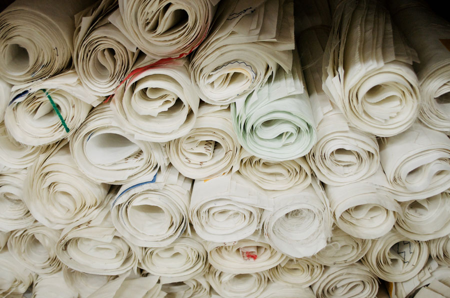 Rolled panels of recycled sail cloth for making totes and accessories