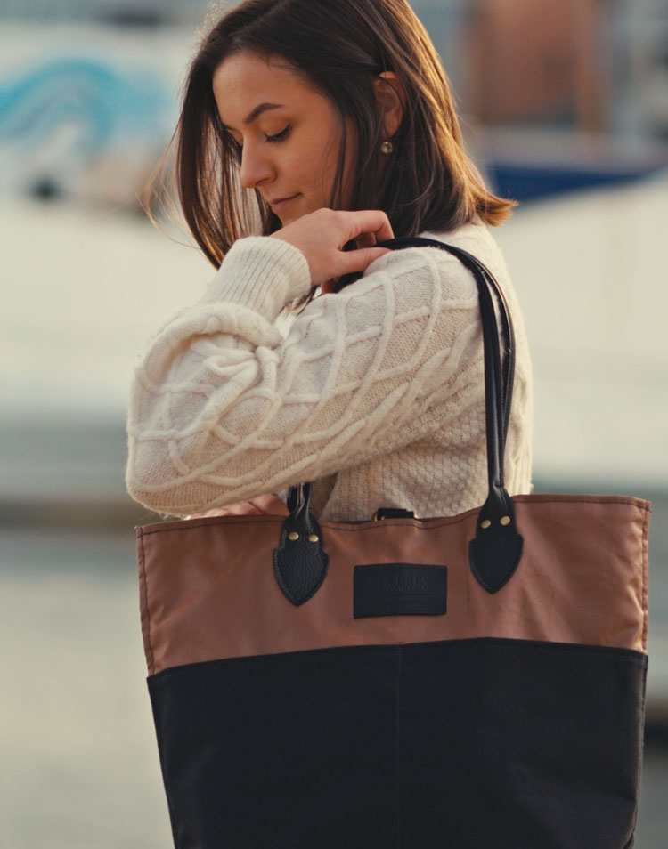 Woman carrying NEW Heritage Tanbark Market Tote on a pier in a marina