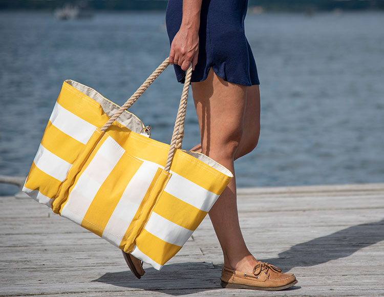 Woman Carrying Yellow Stripe Pier Tote on Dock