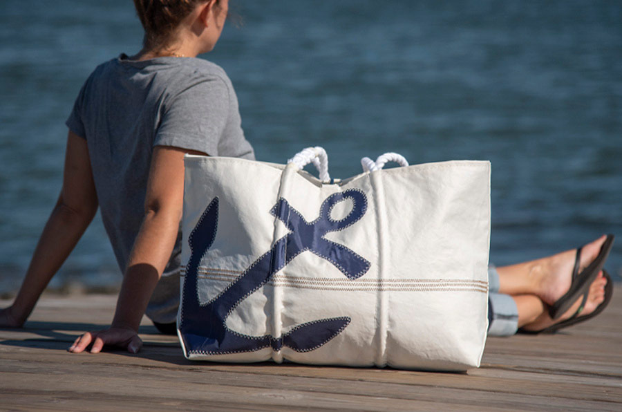 Navy Anchor Large Tote made from recycled sails on a dock