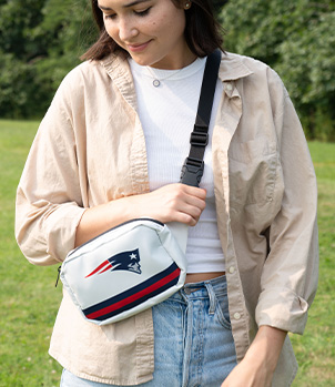 Woman wearing NFL New England Patriots Belt Bag