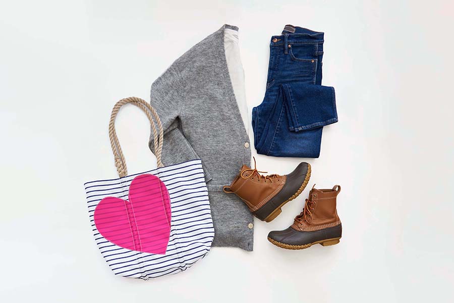Heart Collection Bags complemented with a pair of blue jeans, a white t-shirt, and a cardigan sweater